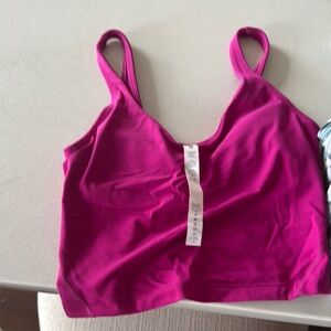 Women's Pink lululemon workout top with removable cups